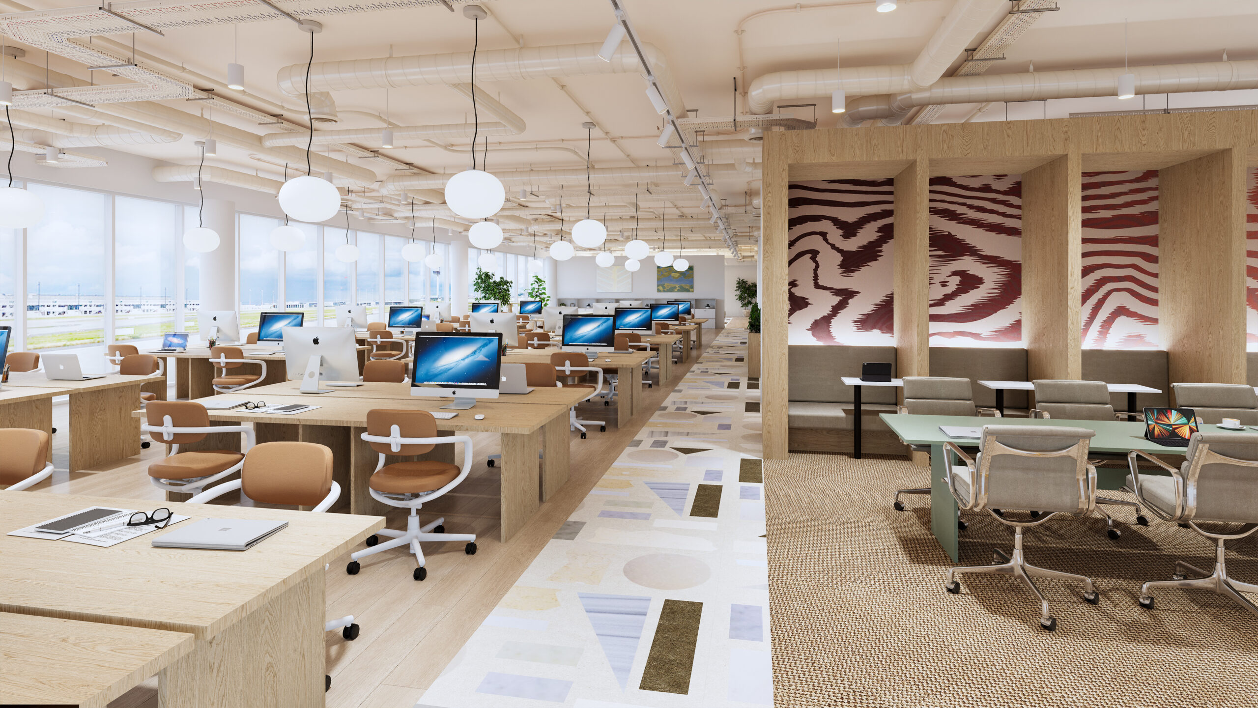Modern open-plan office with rows of desks, computers, chairs, and large windows.